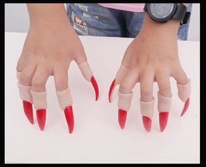 Detailed view of realistic red pointed zombie finger claws for Halloween party costumes