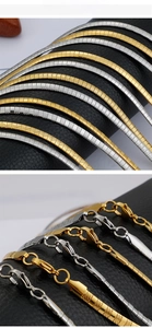 Detailed macro view of 4mm flat snake bone chain necklace in gold and silver finish