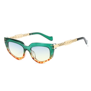 Retro cat-eye sunglasses with green-orange frame and golden chain metal temples