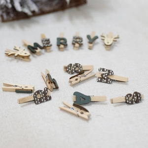 Festive Christmas wooden clips featuring reindeer head and Merry Xmas letters on fabric