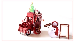 Close-up of 3D Christmas card featuring a red fire truck with Santa and a snowman detail