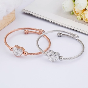 Classic twisted wire heart pendant bracelets in rose gold and silver with cubic zirconia