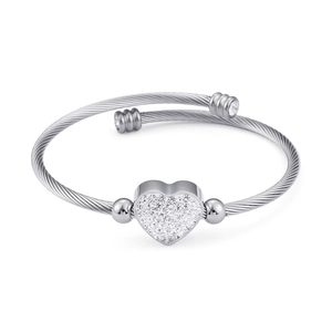 Silver twisted wire cable bracelet featuring a sparkling heart charm and steel beads