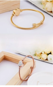 Close-up of twisted cable heart bracelet showing durable rust-resistant metal textures