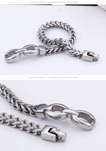 Detailed view of silver wheat chain bracelet with a secure fold-over metal clasp