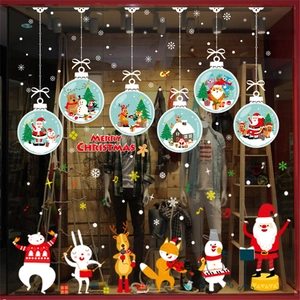 Christmas window stickers set featuring Santa, reindeer and snowflakes on glass display