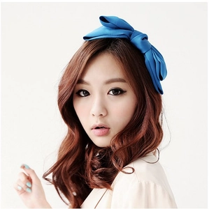 Detailed close-up of a royal blue satin oversized double-layered bow headband for women