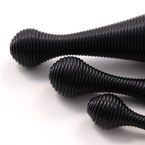 Detail shot of three different sizes of black spiral makeup brush handles with glossy finish