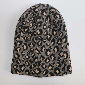 Winter leopard print knitted beanie for men and women featuring warm thermal fabric textures