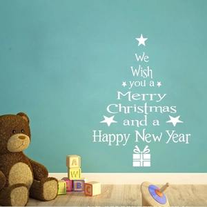 White Christmas tree wall decal with festive lettering and stars on a teal background