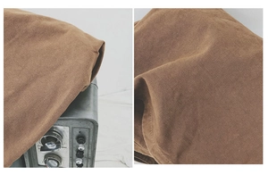 Detail shot of brown heavy canvas fabric texture and vintage-style aesthetic shopping bag