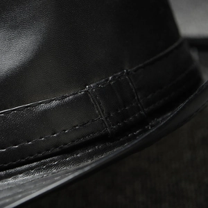 Classic black faux leather jazz fedora hat with double-stitched band detail and texture