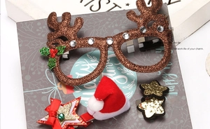 Festive Christmas hair accessory set including glitter reindeer antlers and Santa hat clip
