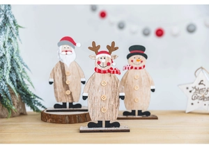 Close-up of wooden Christmas tabletop ornaments featuring Santa, snowman, and reindeer