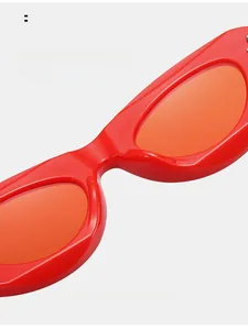 Close-up of stylish red sunglasses featuring smooth integrated nose pads for comfort