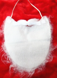 Close-up of white plush Santa Claus beard accessory on a festive red background