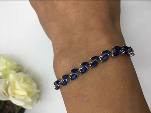 Detail of marquise-cut navy blue zircon stones on a silver-plated women's bracelet