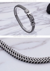 Detail of vintage double-row chain link bracelet with oxidized finish and Ankh symbol clasp