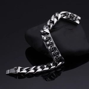Punk style silver skull bracelet for men with chunky Cuban chain and stainless steel finish