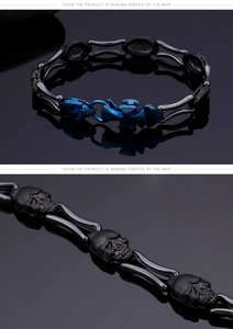 Detail view of punk gothic bracelet with blue skull links and steel cross clasp