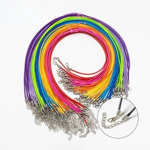 Macro view of colorful wax cord necklace straps with silver lobster clasps and chains