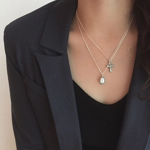 S925 sterling silver layered necklace with cross and oval pendants on model