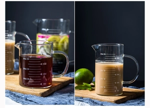 Macro shot of clear graduated heat-resistant glass measuring cups with 500ml liquid detail