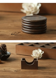 Close-up of walnut wood coasters stacked with a matching square storage holder set