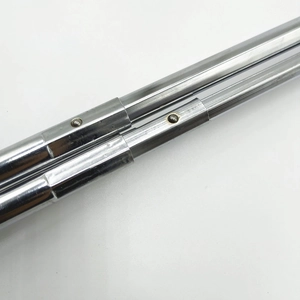 Detail shot of a metal telescopic pole connector with spring buckle for doll accessories