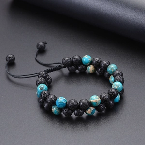 Close-up of double-row lava rock and turquoise beads with adjustable braided cord