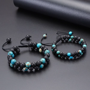 Detail of double-layer volcanic lava and turquoise beaded bracelet with adjustable cord