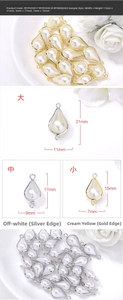 Macro shot of teardrop pearl charms in three sizes with gold and silver alloy edging