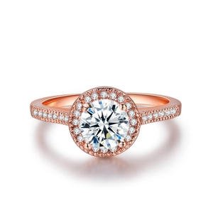 Macro view of rose gold halo ring featuring a round brilliant cut AAA cubic zirconia