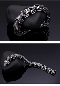 Macro shot of silver dragon scale steel bracelet with punk textured chain detail