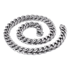 Polished silver cuban link chain for men with decorative clasp on white background