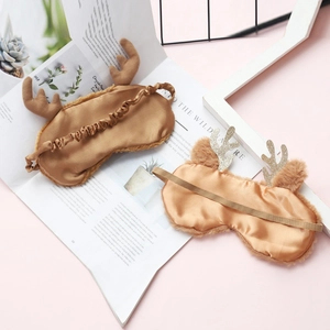 Plush Christmas reindeer sleep masks in dark brown and light gold with silk material