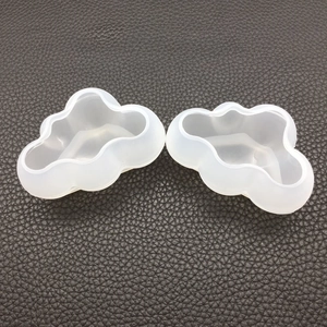 Macro detail of 3D cloud silicone molds for DIY resin casting and aromatherapy candles