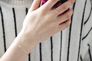 Delicate 14K gold-plated S925 silver ring and bracelet set with minimalist diamond accents