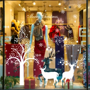 White Christmas reindeer wall sticker with tree and snowflakes on window display
