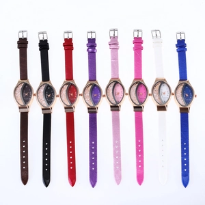 Flat lay view of snake pattern quartz watches with crescent rhinestone dials in eight colors