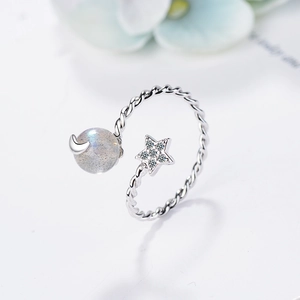 Adjustable silver ring featuring twist band with labradorite moon and zircon star