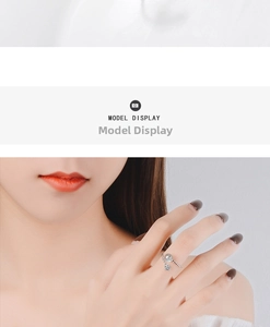 Close-up of star and planet charm open ring worn by model in minimalist silver style