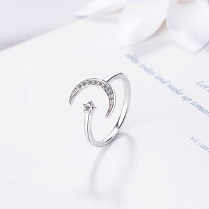 Adjustable silver moon and star open ring with sparkling crystal accents for women