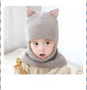 Close-up of baby winter knit balaclava with cute cat ears and fleece lining warm detail