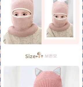 Pink knit cat ear hooded scarf for kids showing thick fleece lining and cozy fit