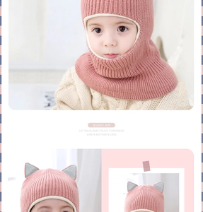 Close-up of pink knit baby balaclava with cute cat ears and thick windproof lining