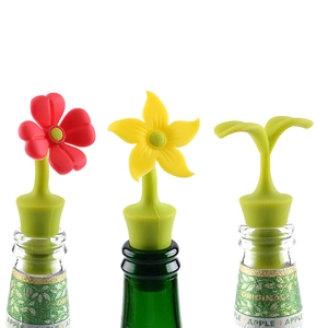 Creative flower shaped silicone wine stoppers in red yellow and green on bottles