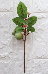 Detail of faux Christmas sprig with red berries and realistic green foliage decor