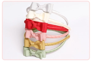Detail of six colorful grosgrain bow headbands for girls with ribbed fabric texture