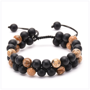 Close-up of double-layer woven natural stone bracelet with adjustable braided cord